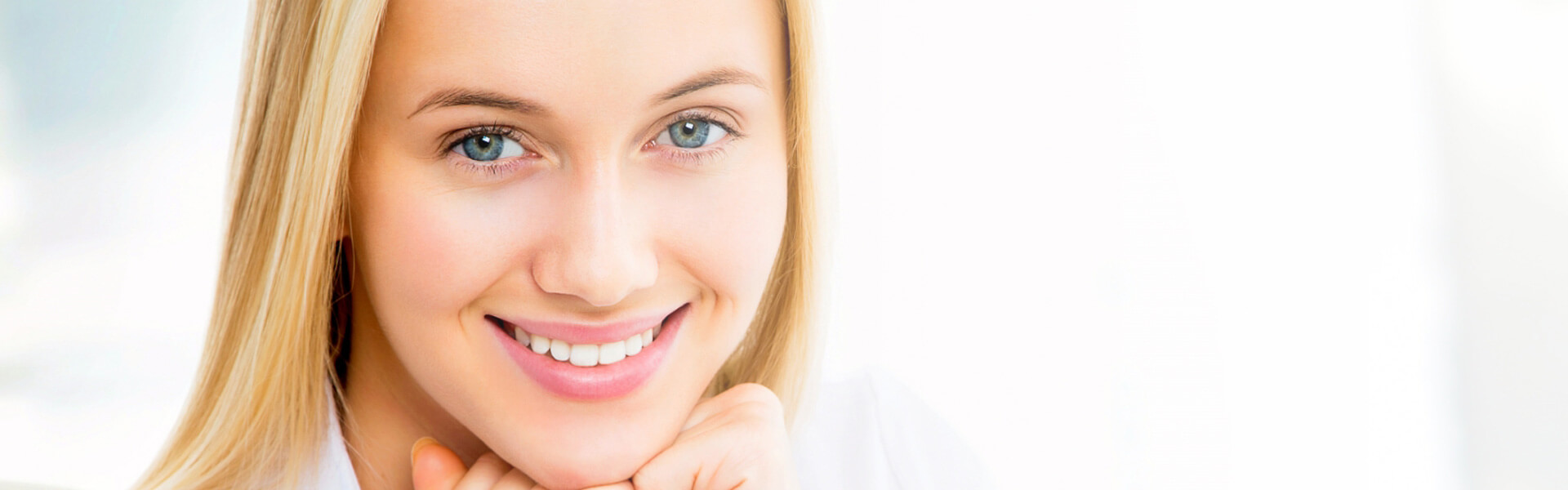 Young beautiful woman smiling showing white teeth